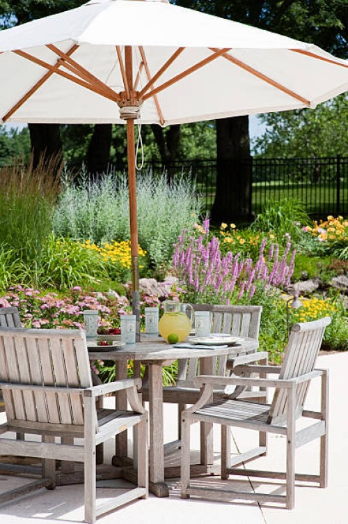 a garden patio with big white umbrella - home decoration stock pictures, royalty-free photos & images