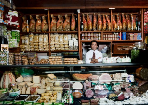 a grocer behind his counter in his shop - food stock pictures, royalty-free photos & images