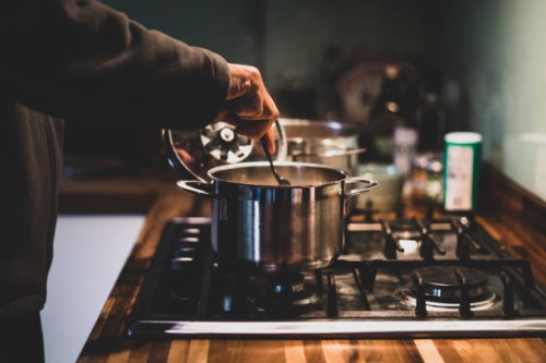 a man preparing dinner - food stock pictures, royalty-free photos & images