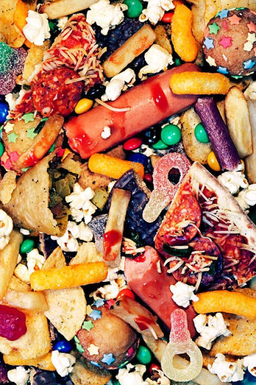 a messy pile of junk food - junk food stock pictures, royalty-free photos & images