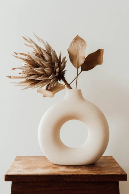 a modern minimalist composition round ceramic vase with dried flower protea - home decoration stock pictures, royalty-free photos & images