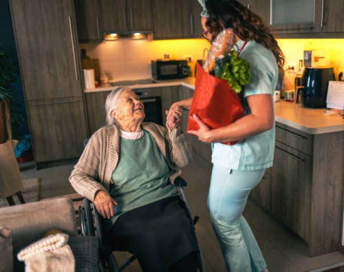 a nurse visits an elderly disabled woman at home and brings her food - food stock pictures, royalty-free photos & images