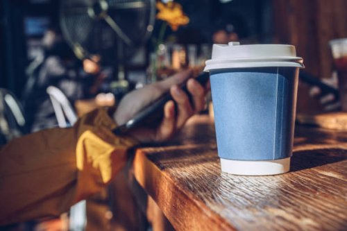 a paper cup of hot coffee in coffee shop. - junk food stock pictures, royalty-free photos & images