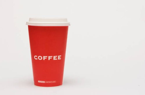 a red cup of coffee on white background. - junk food stock pictures, royalty-free photos & images