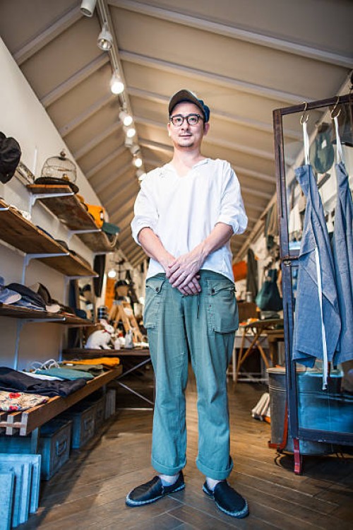 a shop owner in his thirties standing in his shop - fashion stock pictures, royalty-free photos & images