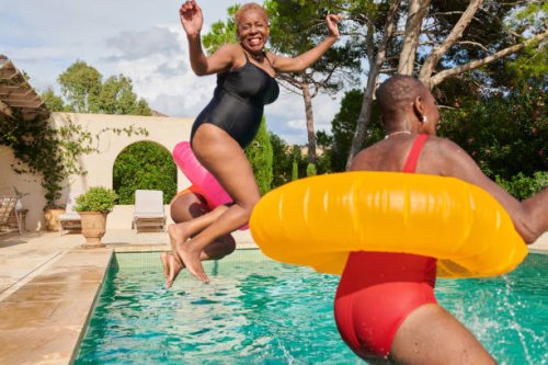 a small group of women jumping into a villa swimming pool - travel stock pictures, royalty-free photos & images
