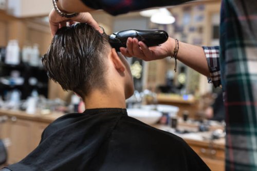 a teenager getting a haircut at the hairdresser's - hairstyle stock pictures, royalty-free photos & images