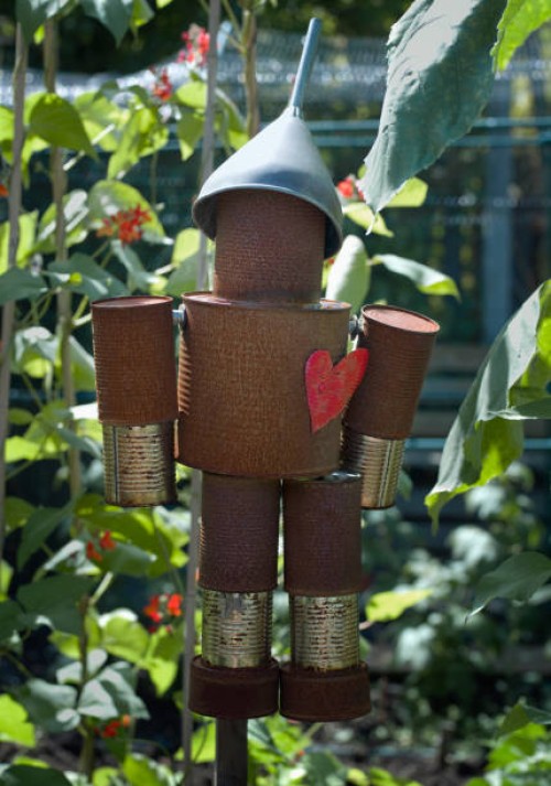 a tin man hanging in a garden - garden decoration stock pictures, royalty-free photos & images