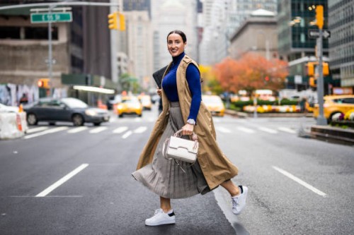 a woman seen running across the street in new york during a busy work day - fashion stock pictures, royalty-free photos & images