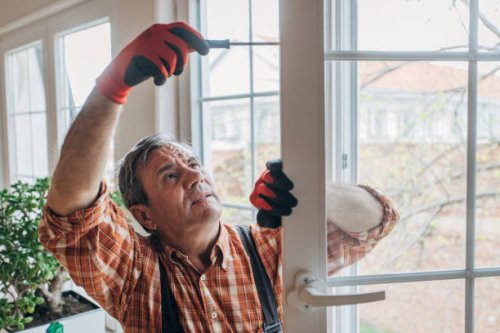 a worker installs windows - home decoration stock pictures, royalty-free photos & images