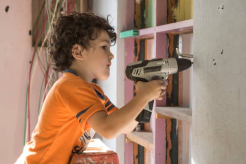 a young boy plays construction worker - home decoration stock pictures, royalty-free photos & images