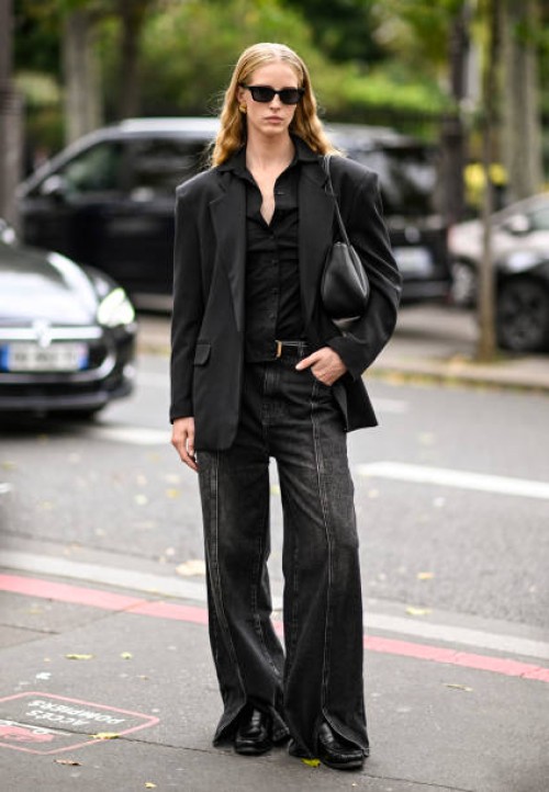 Abby Champion is seen wearing a black blazer, black shirt, black jeans, black bag and black sunglasses outside the Zimmermann show during Womenswear...