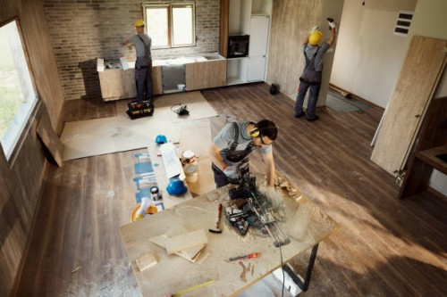 above view of manual workers working on home renovation process. - home decoration stock pictures, royalty-free photos & images