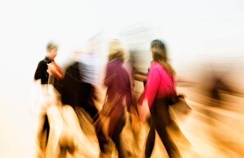 abstract image of motion blurred colorful dressed people walking fast - fashion stock pictures, royalty-free photos & images