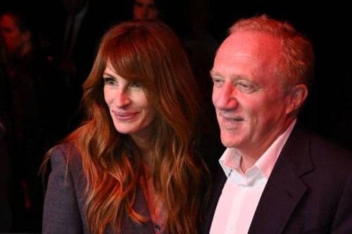 Actress Julia Roberts speaks with French owner of luxury group Kering, Francois-Henri Pinault before the start of Gucci fashion show during the Milan...