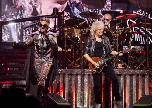Adam Lambert, Brian May and Roger Taylor of Queen + Adam Lambert perform at Little Caesars Arena on October 10, 2023 in Detroit, Michigan.