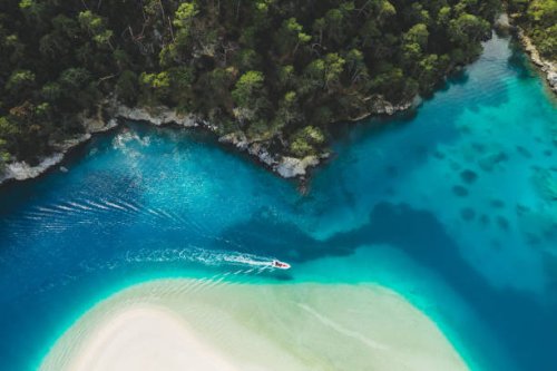 aerial drone view of oludeniz blue lagoon with turquoise sea, paradise white sand beach and tourist boat - travel stock pictures, royalty-free photos & images