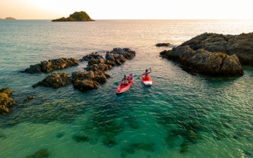 aerial view - two women enjoy the water aqua sport on the seaside. - travel stock pictures, royalty-free photos & images