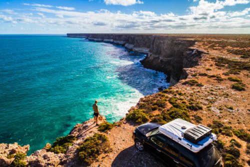 aerial view of car parked with camper and young man overlooking the great australian bight - travel stock pictures, royalty-free photos & images