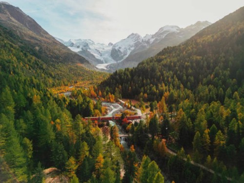 aerial view of train passing pristine landscape of piz bernina in swiss alps - travel stock pictures, royalty-free photos & images