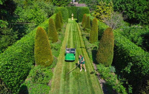 aerial view of woman working in big garden with lawn - garden decoration stock pictures, royalty-free photos & images
