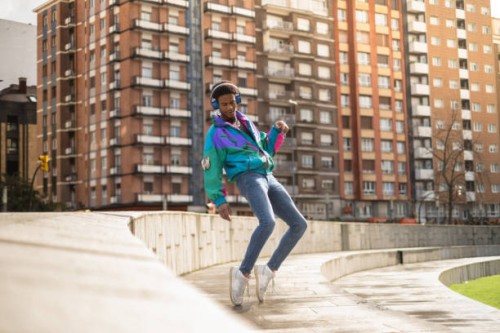 african man dancing listening to music in the city - fashion stock pictures, royalty-free photos & images
