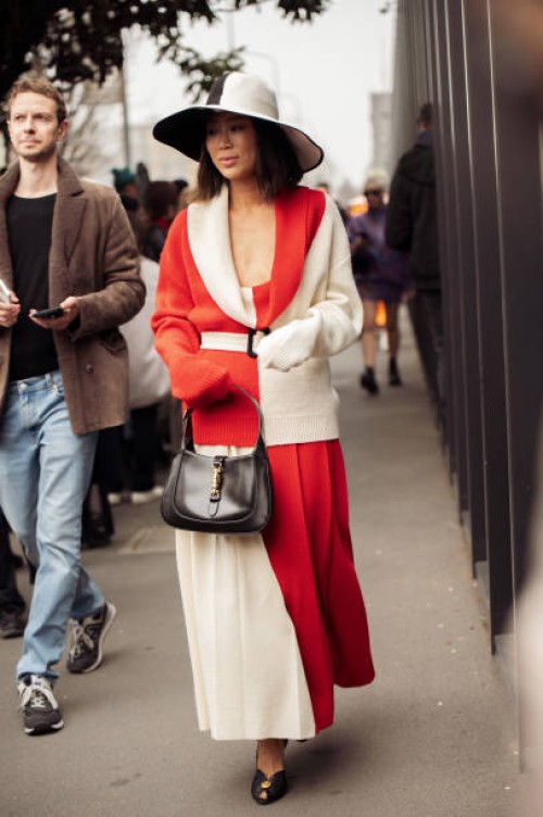 Aimee Song is seen wearing a color-blocked red and white outfit and wide-brimmed hat outside Gucci during the Milan Fashion Week Womenswear...