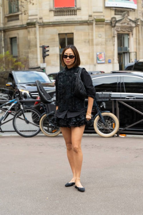Aimee Song wears all Miu Miu with Chanel shoes outside the Miu Miu show during the Womenswear Fall/Winter 2024/2025 as part of Paris Fashion Week on...