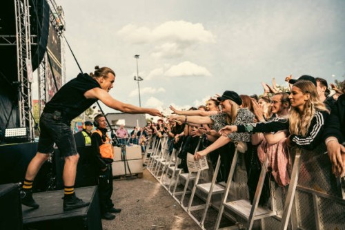 Aki Hakala of The Rasmus hands drumstick to a fan at Jarvenpaa Soi Festival 2022 on August 8, 2022 in Jarvenpaa, Finland.