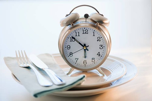 alarm clock on plate - food stock pictures, royalty-free photos & images