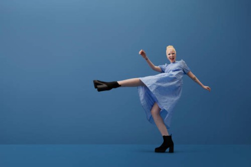 albino woman shouting while kicking leg - fashion stock pictures, royalty-free photos & images