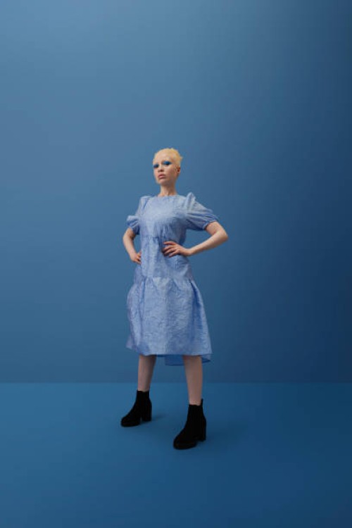albino woman standing with hand on hip - fashion stock pictures, royalty-free photos & images