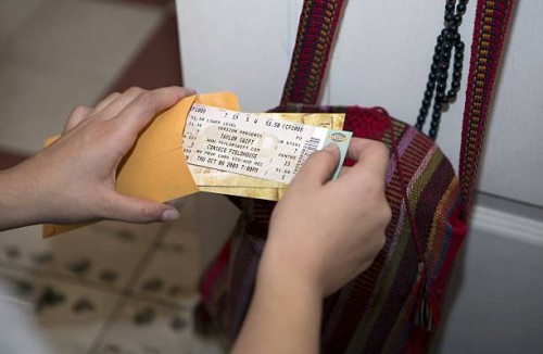 Alejandra Pinzon look at Taylor Swift tickets from a concert she attended in 2005 in the United States in her apartment in Mexico City, June 23,...