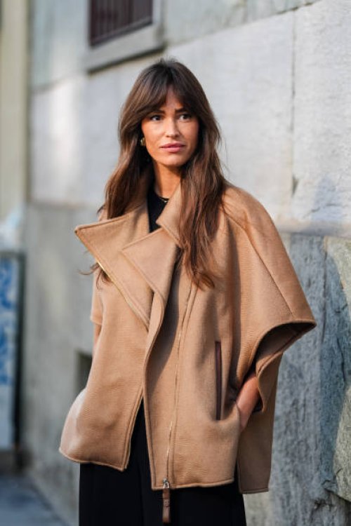 Alison Toby wears light brown short sleeve oversized unzipped jacket, outside Max Mara, during the Milan Fashion Week Spring/Summer 2024-2025 on...
