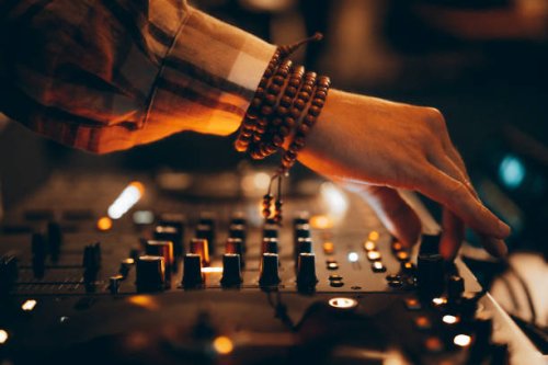 american dj working with sound, spinning turntable records at a night club party - concert stock pictures, royalty-free photos & images
