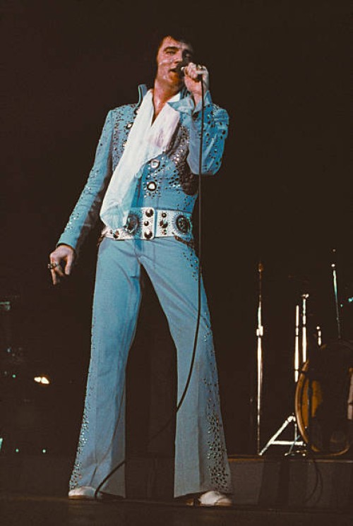 American singer Elvis Presley performing on stage, circa 1972.