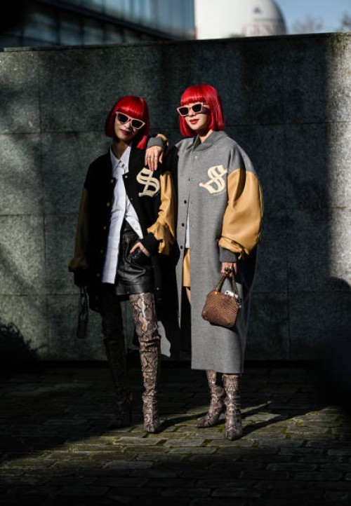 Ami Amiaya and Aya Amiaya wears college jackets, grey, beige coats, boots with snake print, brown silver bags, black shorts, white button shirt \...