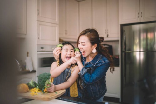 an asian chinese housewife having bonding time with her daughter in kitchen preparing food - food stock pictures, royalty-free photos & images