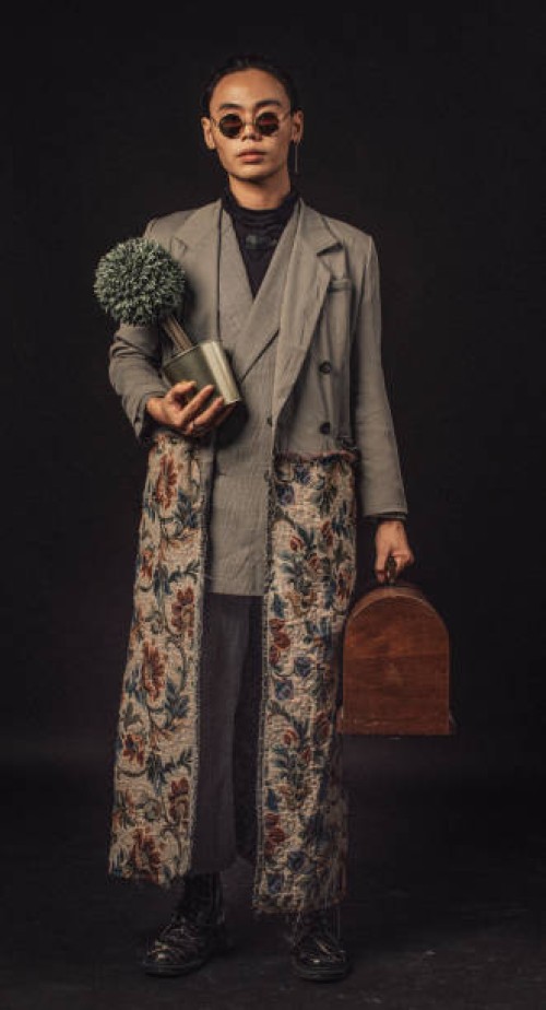 an asian chinese male carrying a plant and a brief case looking at camera with full body length with sunglasses - fashion stock pictures, royalty-free photos & images