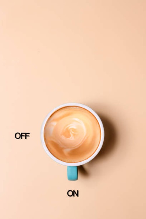 an empty glass cup of coffee on the beige background - junk food stock pictures, royalty-free photos & images