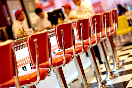 an empty red seats in the restaurant - junk food stock pictures, royalty-free photos & images