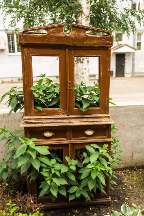 an old broken wardrobe stands on the street as a decor - garden decoration stock pictures, royalty-free photos & images