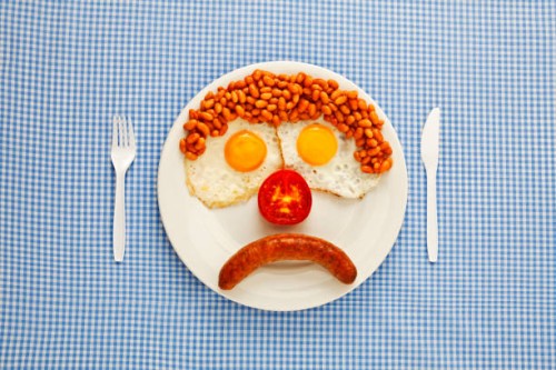 an unhappy fast-food breakfast - junk food stock pictures, royalty-free photos & images