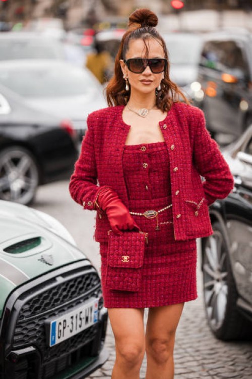 Anna Rosa Vitiello wears red tweed top with matching mini skirt, jacket and bag, red leather gloves, outside Chanel, during the Womenswear...