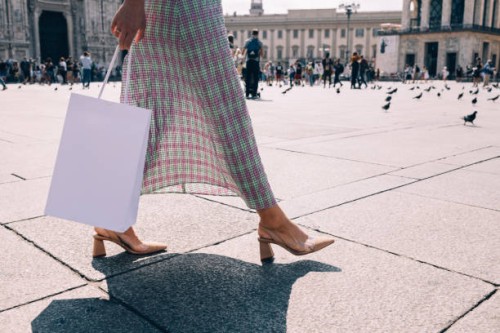 anonymous businesswoman walking on the street after work - fashion stock pictures, royalty-free photos & images