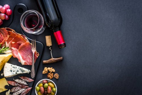 appetizer frame: red wine, iberico ham and cheese on rustic table - food stock pictures, royalty-free photos & images