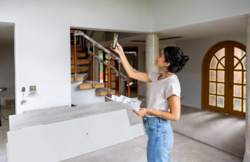 architect remodeling a house and taking pictures with her cell phone - home decoration stock pictures, royalty-free photos & images