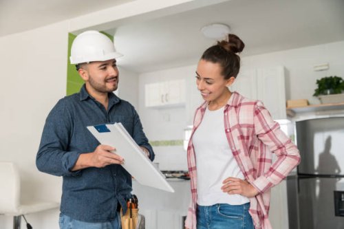 architect talking to a woman about remodeling her house - home decoration stock pictures, royalty-free photos & images
