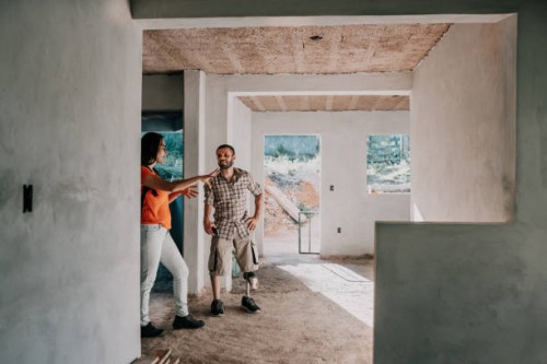 architects talking at house construction - home decoration stock pictures, royalty-free photos & images