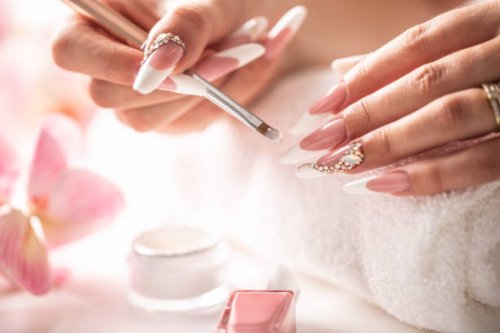 art manicure drop of gel, woman applies gel with brush on nails. - nails art stock pictures, royalty-free photos & images